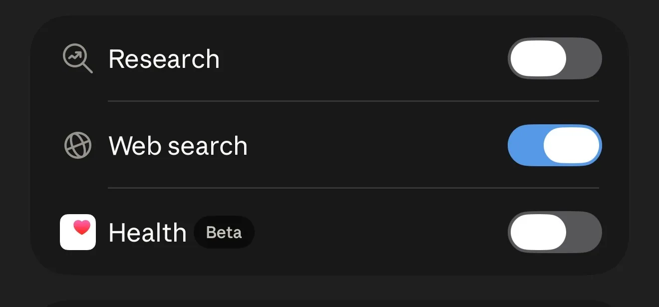 Lista de herramientas de Claude con Research, Web search y Health (etiqueta Beta), cada una con su interruptor